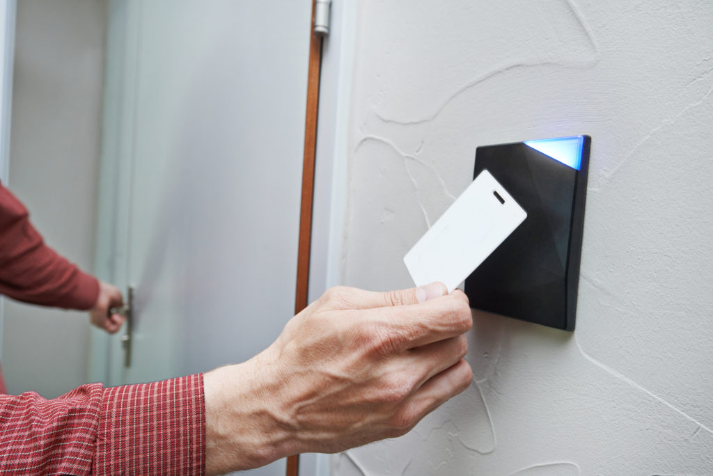 man using keycard to get access to door